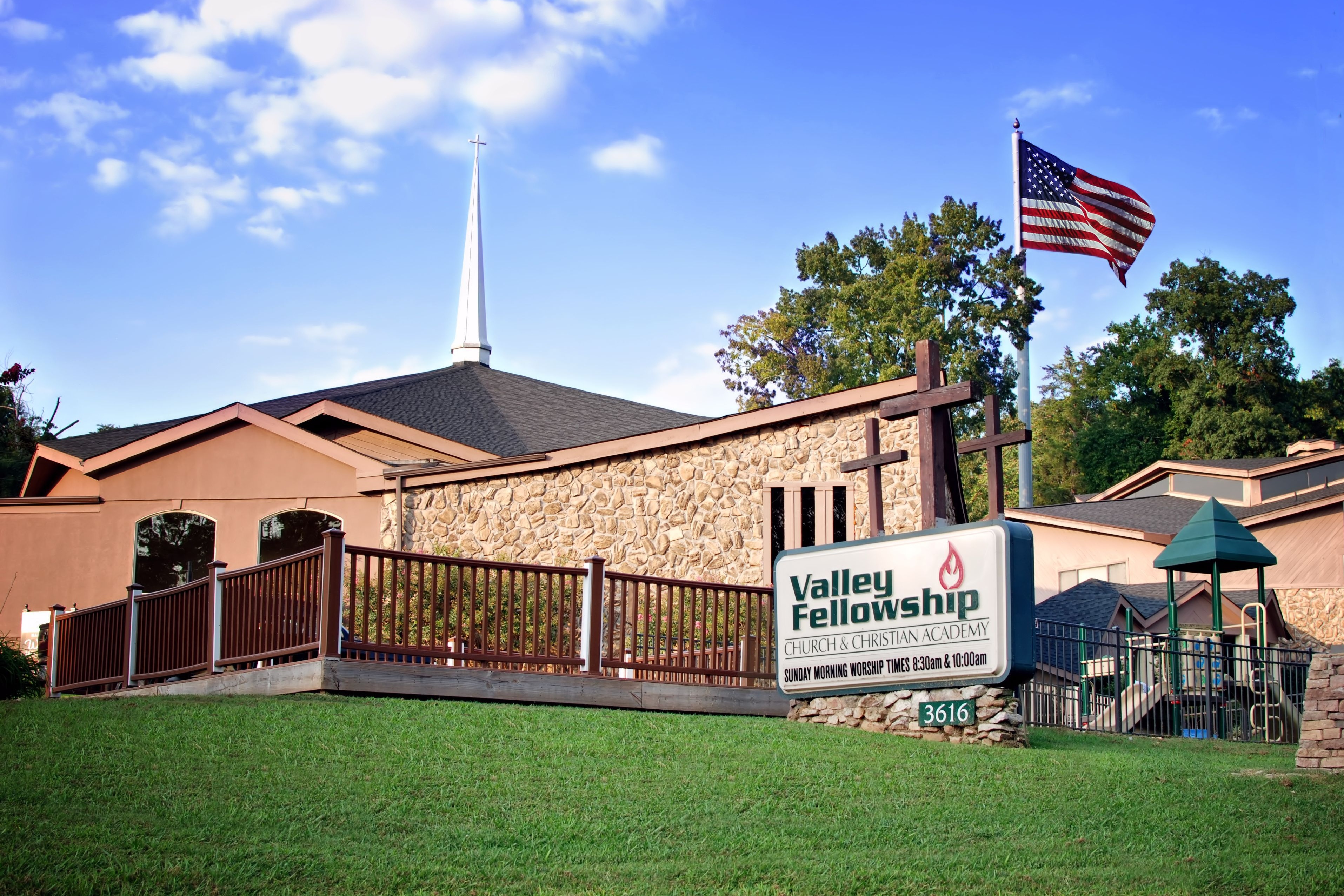Valley Fellowship building with a sign and an American flag